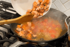 Add seared salmon for Tomato Basil Salmon Pasta