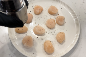 Season scallops for 8 Minute Seared Scallops