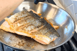 Sear the other side of the salmon for Crispy Skin Salmon
