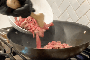 Add beef to the wok for Broccoli Beef Stir Fry