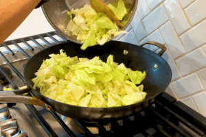 Add cabbage for Crispy Bacon and Savory Cabbage Stir-Fry