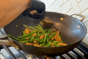Add green beans for Easy Stir-Fried Pork with Green Beans