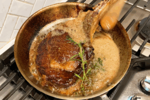 Baste with butter and herbs for Reverse-Seared Tomahawk Steak