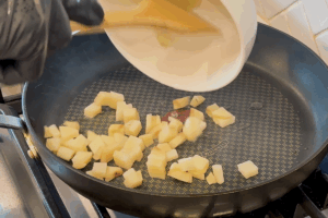 Cook potatoes for Steak and Eggs Breakfast