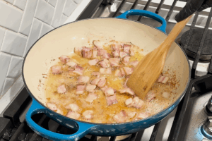 Cook the bacon for Crispy Braised Chicken with Bacon and Cabbage