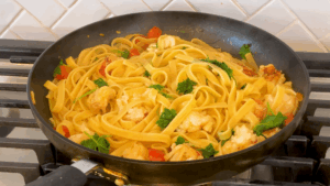 Put together lobster and pasta for Lobster Fettuccini with Shell Broth