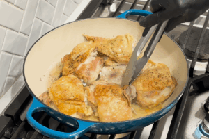 Sear the chicken for Crispy Braised Chicken with Bacon and Cabbage
