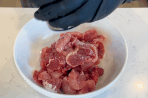 Season the pork for Easy Stir-Fried Pork with Green Beans