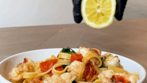 Squeeze lemon juice for Lobster Fettuccini with Shell Broth