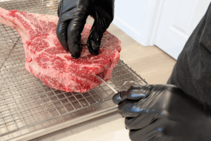 Use Probe Thermometer for Reverse-Seared Tomahawk Steak