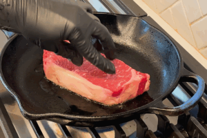 Sear the steak for Steak and Eggs Breakfast