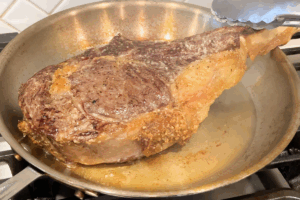 Sear the steak for Reverse-Seared Tomahawk Steak