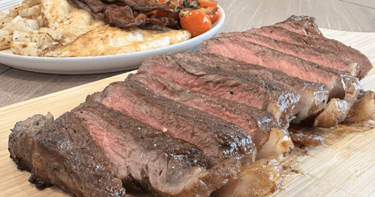 Easy Steak and Eggs Breakfast with Potatoes, Bacon, and Tomatoes