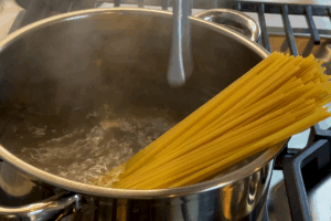 Boil the pasta for Garlic Clam and Shrimp Pasta