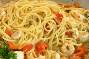 Stir everything well to coat for Garlic Clam and Shrimp Pasta
