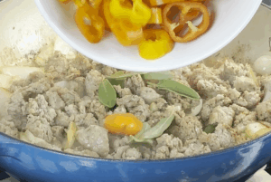 Add aromatics and veggies for One-Pot Italian Sausage