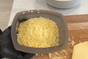 Grated cheddar cheese for Creamy Instant Noodle Carbonara Hack