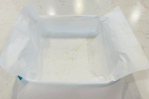 Prepare the pan for Pumpkin Chocolate Swirl Brownies