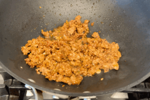 Simmer the minced pork for Easy Minced Pork Sauce Udon