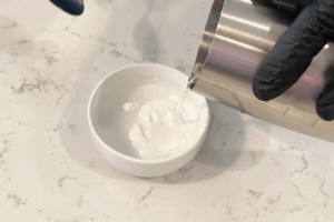 Add water to potato starch for Golden Pumpkin Pork Stir-Fry