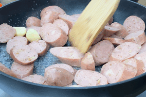 Cook the sausage for Buttery Sausage & Cabbage Stir-Fry