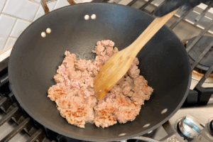 Flip the pork and cook another 1-2 minutes for Golden Pumpkin Pork Stir-Fry