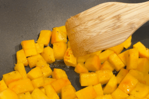 Sear the pumpkin to brown for Golden Pumpkin Pork Stir-Fry