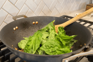 Add the basil for Easy Basil Pork Stir Fry