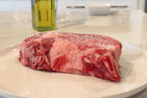 Season the Reverse-Seared Ribeye