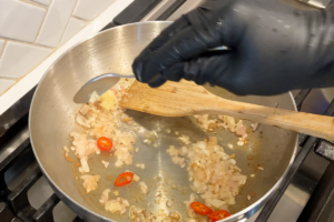 Build the flavor with shallots, chili slices and garlic paste