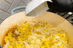 Deglaze and add garlic for One-Pan Sausage and Sauerkraut