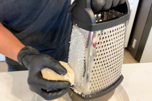 Grate the fresh Parmigiano Reggiano
