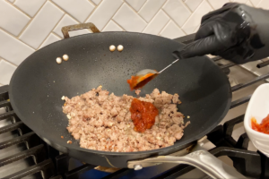 Add the bean paste for Easy Mapo Tofu
