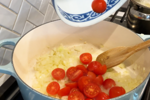 Add the cherry tomatoes for Viral Trader Joe’s Lobster Bisque Pasta